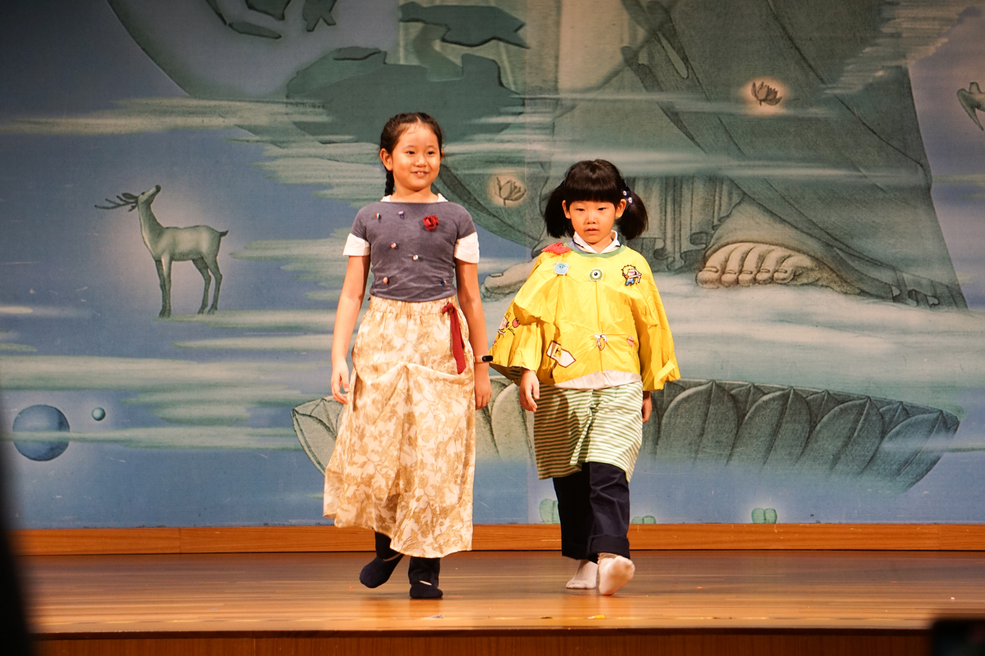 Children confidently display clothing made from environmentally friendly materials. (Photo by Yam Zhikai)  