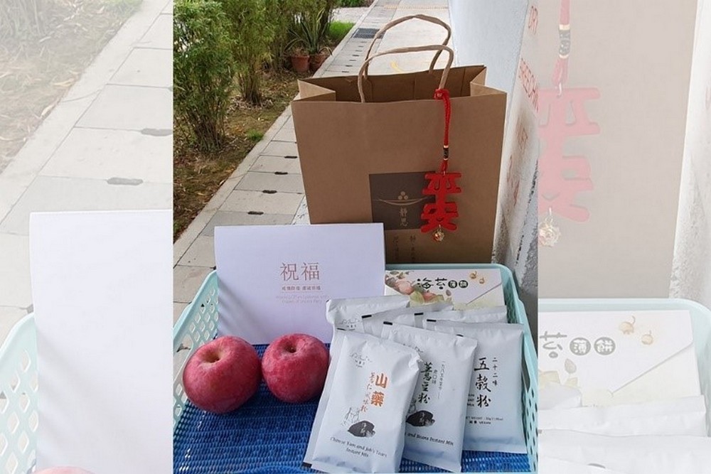 The care package and its contents, including a card, fruits and packets of instant mix. (Photo by Susan Tan)